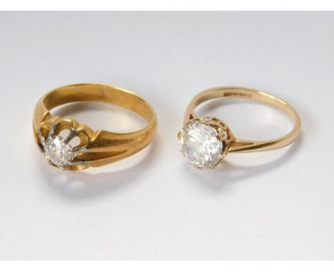 GOLD RINGS. An 18ct. gold solitaire diamond ring, the stone of approx. 0.50ct. spread. Approx. 5.6g. Size O. Also, a 14ct. go