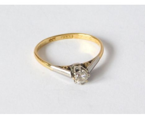 DIAMOND RING. An 18ct. gold & platinum solitaire diamond ring. The stone of approx. 0.20ct. spread. Size K.  Please note that