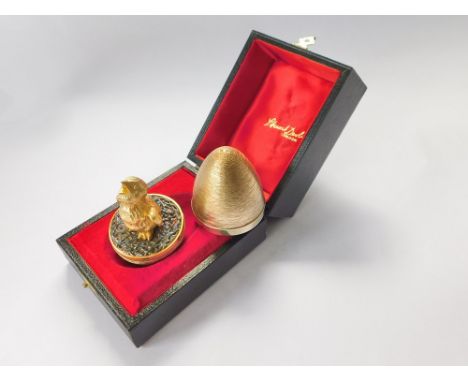 STUART DEVLIN. A Stuart Devlin textured silver gilt Surprise Egg, opening to reveal a silver gilt chirping chick on a texture