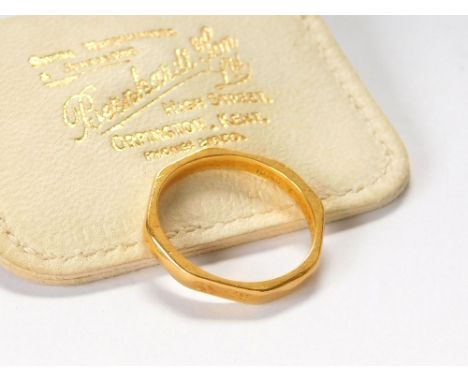 WEDDING BAND. A 22ct. gold octagonal wedding band stamped 'Fidelity' to the inner shank. Approx. 3.7g. Size M/N.  Please note