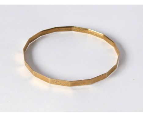 SLAVE BANGLE. A 9ct. gold slave bangle. Chester 1930. With inscription. Approx. 13.3g.  Please note that all items in this au
