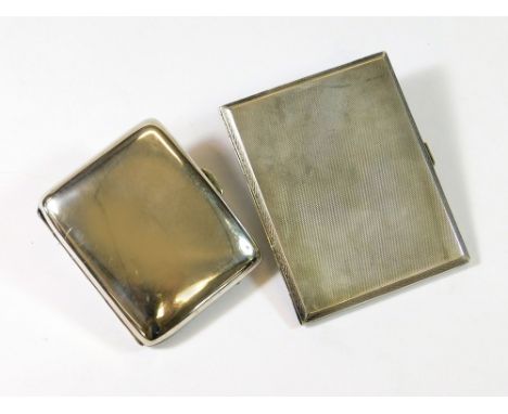 CIGARETTE CASES. An Art Deco engine turned silver cigarette case, Birmingham 1930 & a plain Edwardian silver cigarette case. 