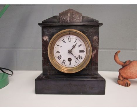 A late 19th/ early 20th Century slate and marble timepiece, French 8-day pendulum movement, white enamel dial with Roman nume