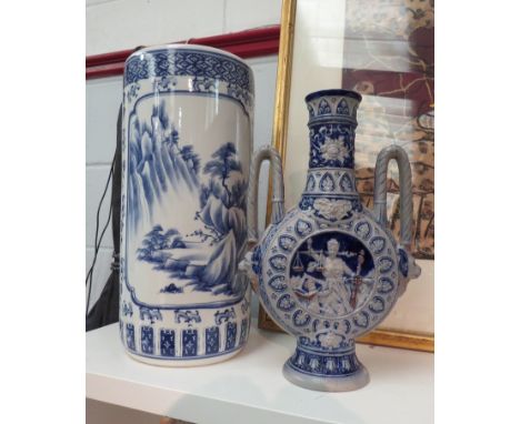 A blue and white umbrella/stick stand with bird and foliate decoration together with a twin handled vase possibly depicting T