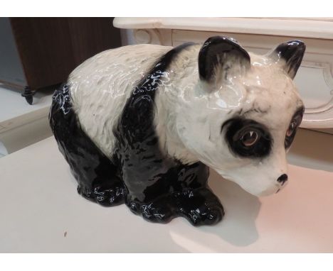 A ceramic panda: No 1, made in England, 35cm length 