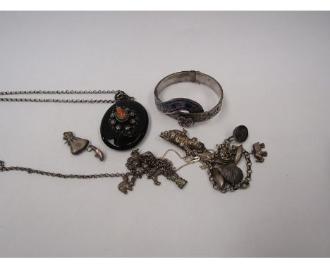 A Victorian french jet oval memoriam locket with glass panel back, bangle, bracelets etc 