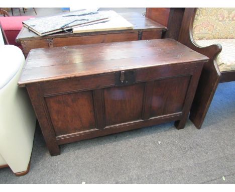 An 18th Century oak three panel coffer on stile feet, 54 x 101 x 43cm 