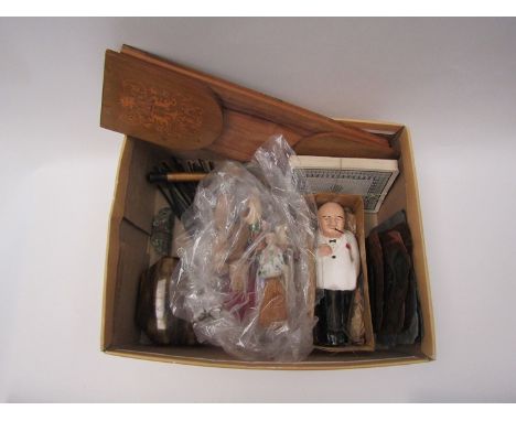 A mixed lot including vintage smoking statesman figure, Welsh loving spoon, ceramic bottle stoppers, bookslide etc. 