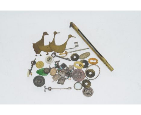 Small plastic box containing quantity of miscellaneous metal items, some cuff links, badges, thermometer in brass case and so