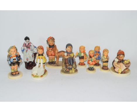 Collection of nine various Goebel/Hummel models of children and a further porcelain figure of a lady with a lamb largest 12cm
