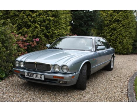 A 1994 Jaguar XJ12 (X305), registration number J600 ALX, light metallic blue. This flagship six litre Jaguar was purchased by
