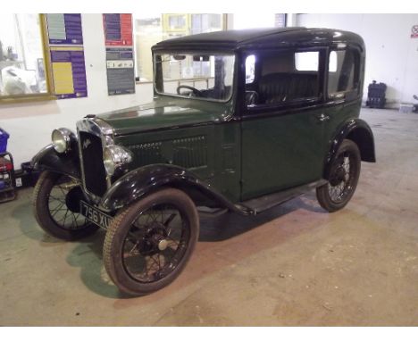 A 1933 Austin Seven two door saloon, registration number 756 XUH, green over black. Herbert Austin's baby Austin was designed