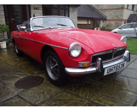 A 1974 MG B roadster, registration number UHT 653N, Tartan red. The MG B is one of world's most recognisable sports cars and 