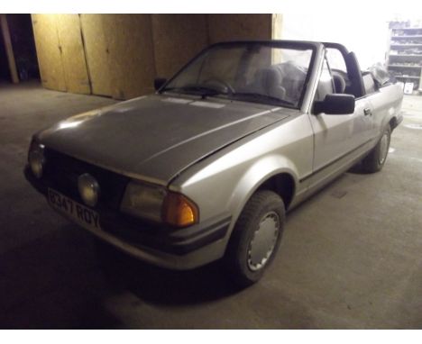 A 1983 Ford Escort Cabriolet, registration number B347 RDY, silver. This Escort Cabriolet is a restoration project. It was pu