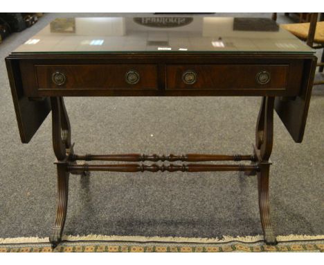 A mid 20th century mahogany sofa table, two short drawers to frieze , lyre supports, double refrectory stretcher