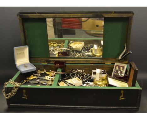 Costume jewellery, an enamel floral brooch, others; beads, chains, pendants, compact etc contained in a large wooden box