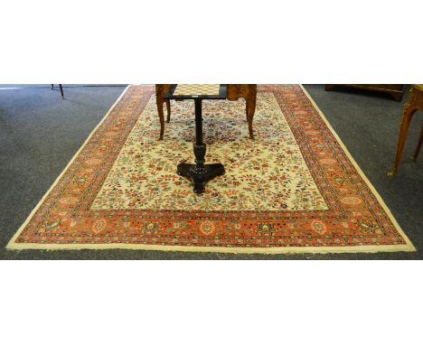 A Ziegler Mahal Carpet, central cream rectangular reserve with stylised flowers, banded red border with geometrical flowers, 