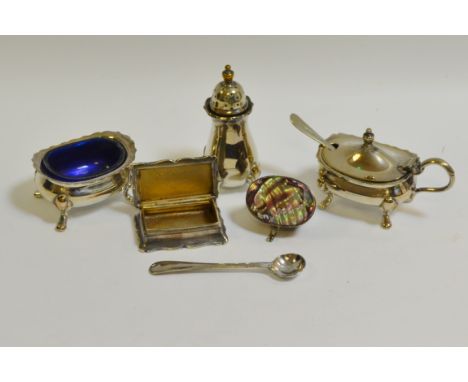 A Mexican silver coloured patch box, abalone shell mount; silver plated snuff box; silver plated condiment set, blue glass li