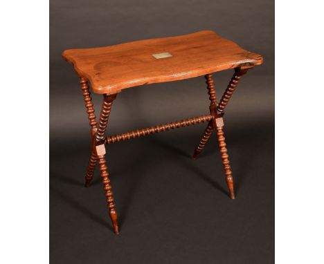 A 19th century shaped rectangular deck table, bobbin turned X shaped legs, the top with plaque ' This Table is made from a pi