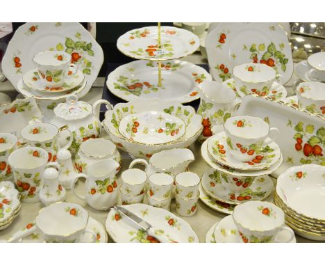 A comprehensive Queens china Virginia Strawberry pattern tea service comprising of teapot sugar bowl cream and milk jugs; san