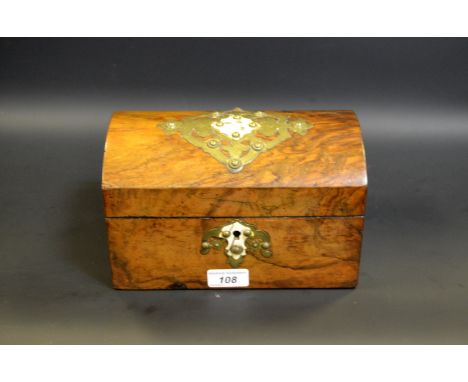 A Victorian walnut tea caddy, hinged domed cover applied with cut-card work, enclosing a pair of covered compartments, c.1870