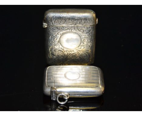 A Chester silver vesta case, vacant cartouche by William Naul c. 1900; another engine turned silver vesta 65.3g gross (2)