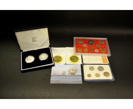 Coins - a pair of £5 commemorative  coins; Farewell to the £SD system coins, cased; two Nelson commemorative Crowns Britains 