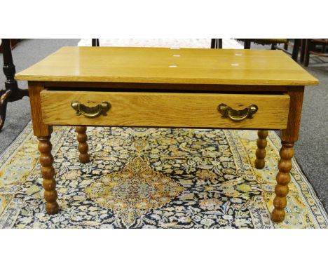 A late 20th century oak coffee table , bobbin turned supports 