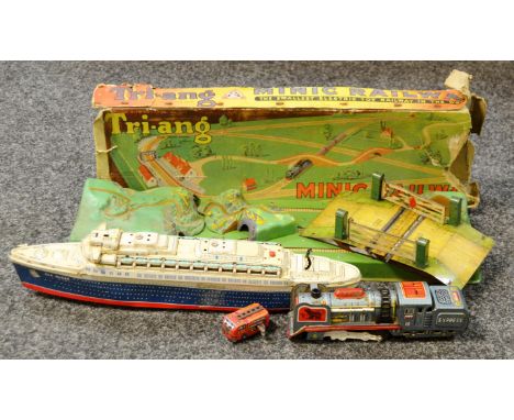 Toys - a tin plate sea queen; a tin plate Express train; a tin plate clockwork fire engine; a Hornby series railway junction 