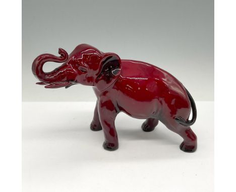 This medium sized figural is glossy red with trunk up in a walking stance. Royal Doulton backstamp. Artist: Charles NokeIssue