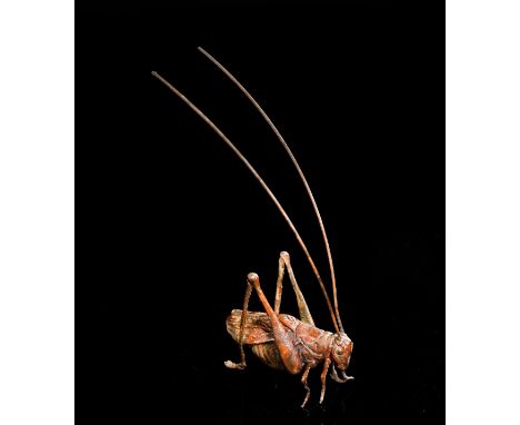 A Japanese Bronze Figure of a Cricket with Long Antennae.Cast in naturalistic detail, this charming Japanese bronze depicts a