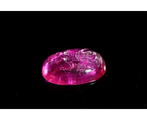 An Indo-Persian Carved Pink Gemstone Intaglio of a Falconer, Possibly RubyA vivid pink cabochon gemstone intaglio, possibly r