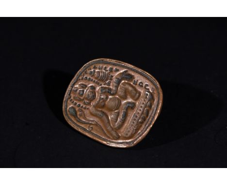 A Tibetan Bronze Stamp Seal with Avalokiteshvara Motif.A Tibetan bronze stamp seal featuring a depiction of Avalokiteshvara, 