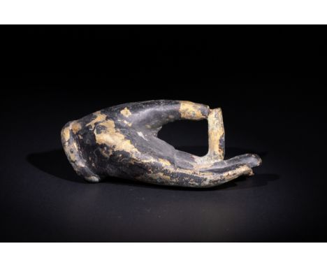 **NO RESERVE**A Tibetan Gilt Bronze Buddhist Hand in Vitarka Mudra.A cast bronze hand fragment with traces of gilding, elegan