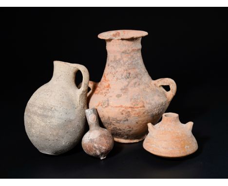 **NO RESERVE**A Collection of Roman Terracotta Vessels.The assemblage includes a tall handled amphora with a wide flared rim,