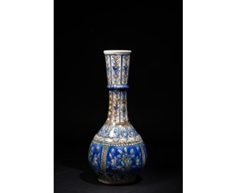 A Qajar Ceramic Vase with Floral Motifs, 19th Century.A Qajar ceramic vase, featuring a slender neck with a pronounced ring c