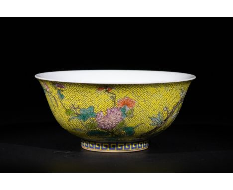 A Chinese Yellow-Ground ‘Floral Scroll’ Porcelain Bowl with Four Character Marks to the Base.A porcelain bowl featuring a den