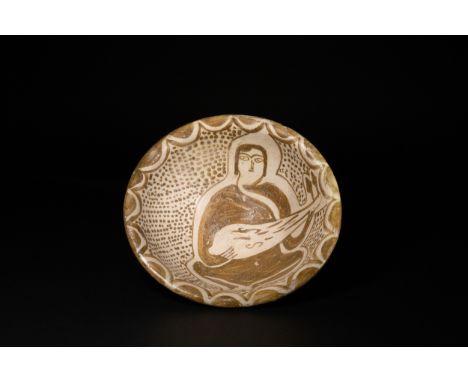 An Abbasid Islamic Ceramic Bowl with Figural Decoration, 10th–11th Century.An Abbasid ceramic bowl decorated in brown slip un