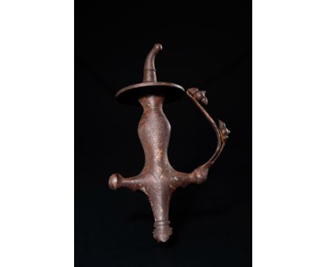 An Indian Sikh Iron Pesh Kabz Dagger Hilt.The hilt is constructed in iron with a striking sculptural silhouette featuring a w