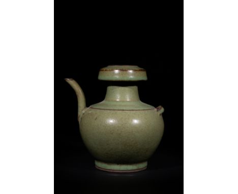A Chinese Celadon-Glazed Crackled Ewer with Twin Spouts.A Chinese ceramic ewer with a rounded body and a curved spout, covere