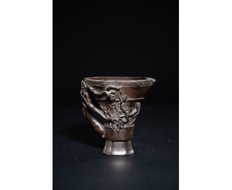 A Chinese Carved Libation Cup with Plum Blossom, with Four-Character Seal Mark to the Base.A dark-toned Chinese libation cup,