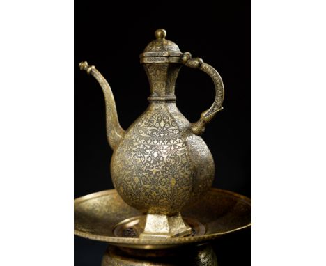 An Indo-Persian Brass Ewer Set with Basin and Footed Stand, 19th CenturyA finely engraved Indo-Persian brass ewer accompanied
