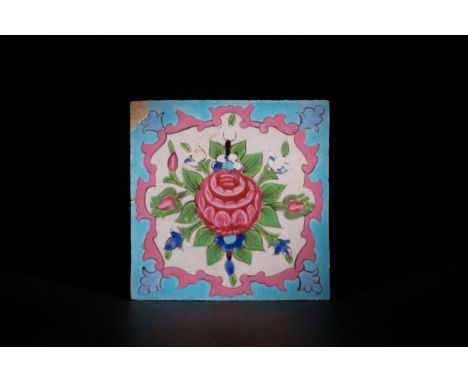 **NO RESERVE**A Qajar Glazed Ceramic Tile with Floral Motif, Persia, 19th–20th Century.The tile features a central rose in fu