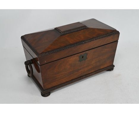 A Regency mahogany sarcophagus shaped twin compartment tea caddy