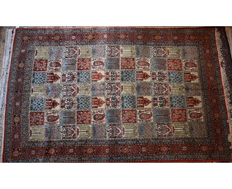 A Persian Qum carpet, multi-coloured tile design 335 cm x 211 cm (10204)&nbsp;good overall condition, colours well balanced a