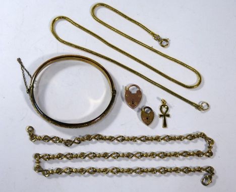 A silver-gilt half hinged bangle with foliate chasing, two gilt metal necklace chains, two 9ct rose gold padlocks and unmarke