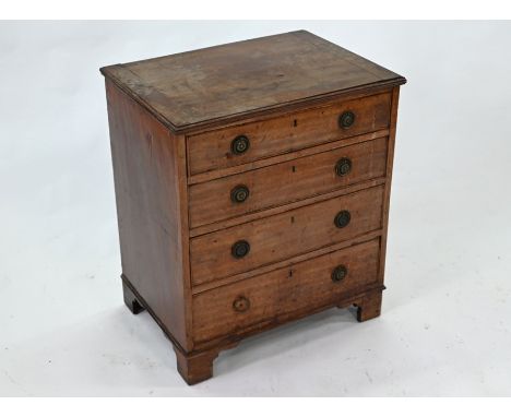 An early 19th century mahogany four drawer chest, raised on shaped bracket feet, 64 cm wide x 45 cm deep x 73 cm high