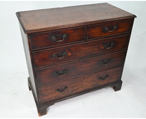 A George III mahogany chest of two short over three long graduated cockbeaded drawers, with original brass swan neck fittings