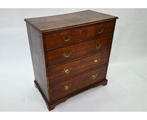 An 18th century oak chest of four long graduated drawers on shaped bracket feet, 82 cm wide x 46.5 cm x 86 cm high
