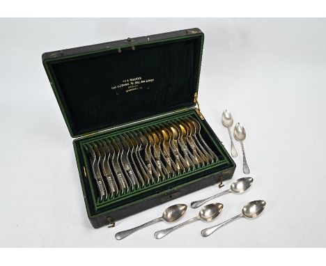 A 19th Century German low-grade white metal and parcel-gilt set of beaded flatware by Sy &amp; Wagner of Berlin, stamped '750